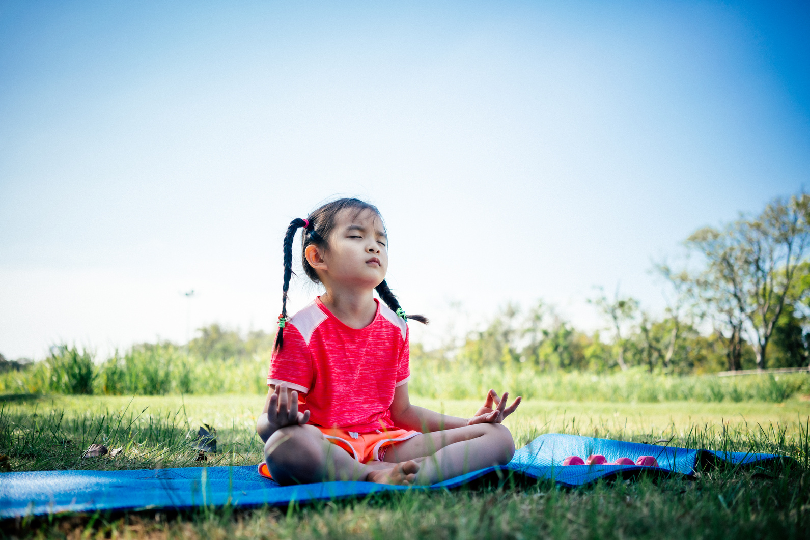 Asian children girl practicing meditation